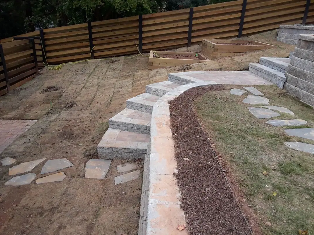 Stained horizontal fence above new stone steps